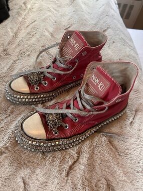 Red Studded High-Top Sneakers with Metallic Accents